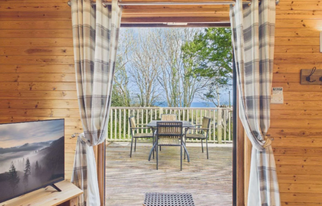 Logde Lounge Opening Onto Private Decking Through
