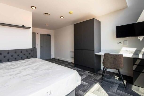 Bright and spacious master bedroom featuring a ...