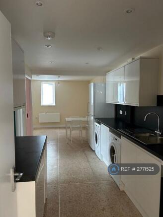 Kitchen With Shared Fridge Freezer