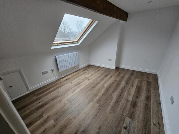 Bright, newly refurbished attic bedroom with a ...