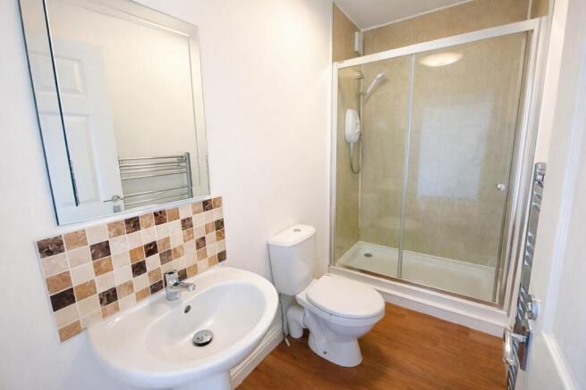 Bright modern bathroom with shower and vanity...