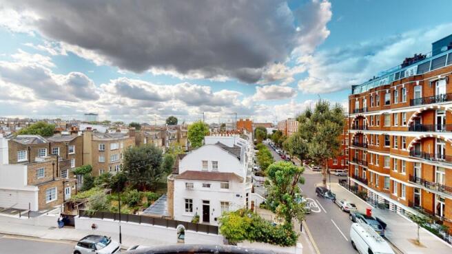 A bright and inviting street view featuring cha...