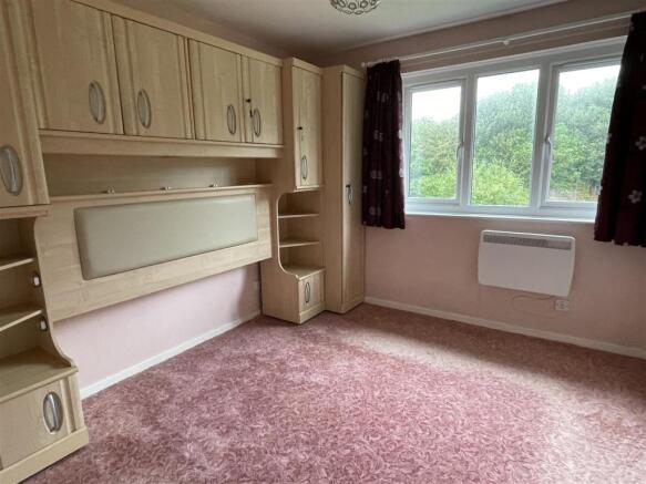 Bedroom 1: pink carpry