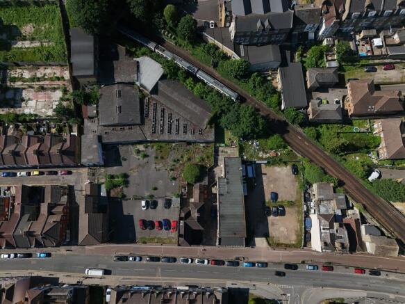 Aerial view showing the site's main road frontage and nearby public car park