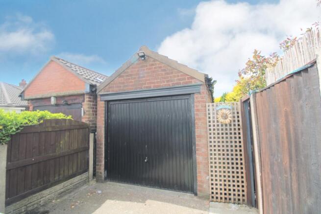 Detached garage with additional parking