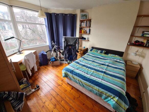 A cozy and inviting bedroom featuring a double ...