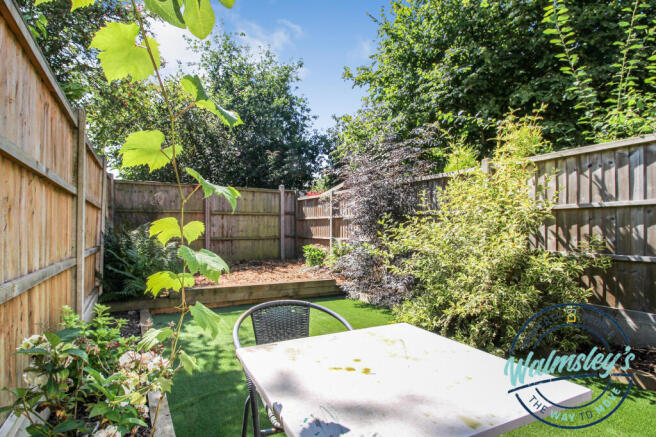 Rear gardens with artificial grass, sleepers & sit