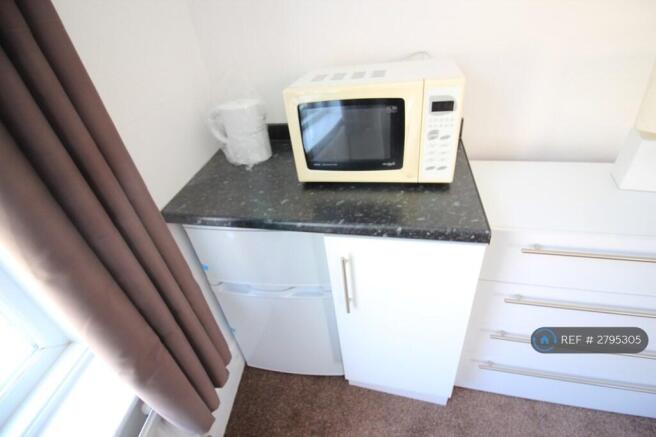 Bedroom With Private Bathroom And Kitchenette