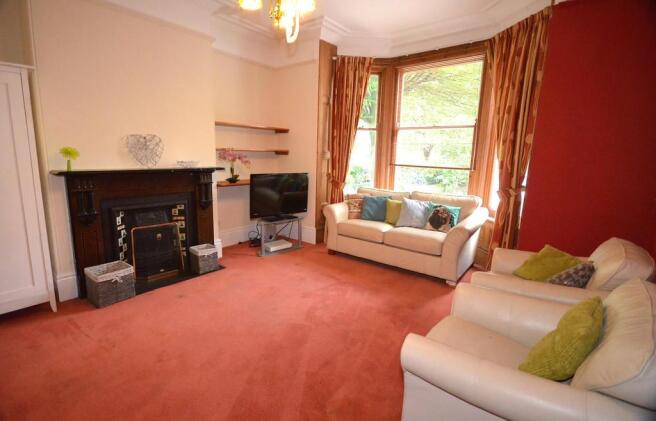 Bright and inviting living room featuring two c...