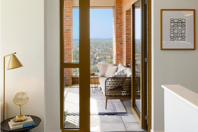 Photograph looking out towards balcony from dining area