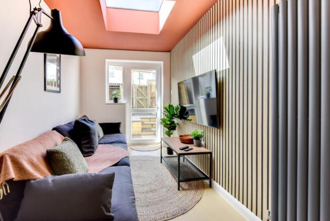 Bright, stylish sitting room with a comfortable...