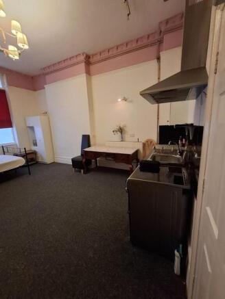 Expansive bedroom with convenient kitchenette a...