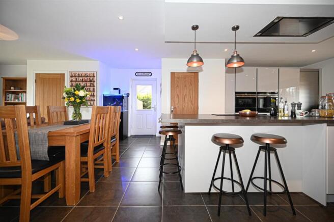 Living kitchen with bifolding doors into gardens