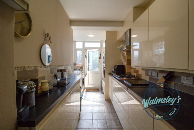Modern kitchen with doorway to garden