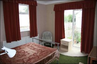 BEDROOM 1/DINING RM