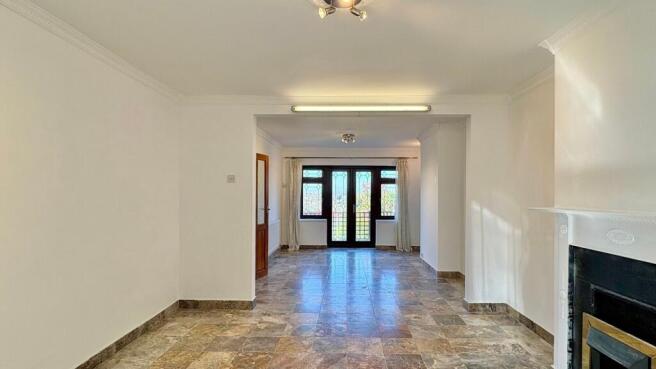 Bright open-plan living area with marble floors...