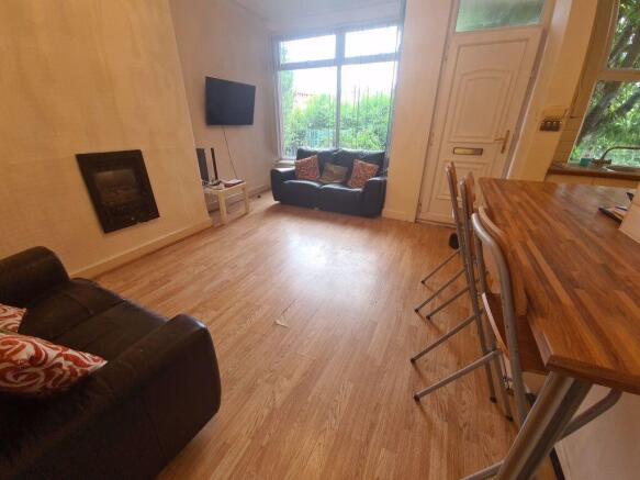 Bright and welcoming living room featuring comf...