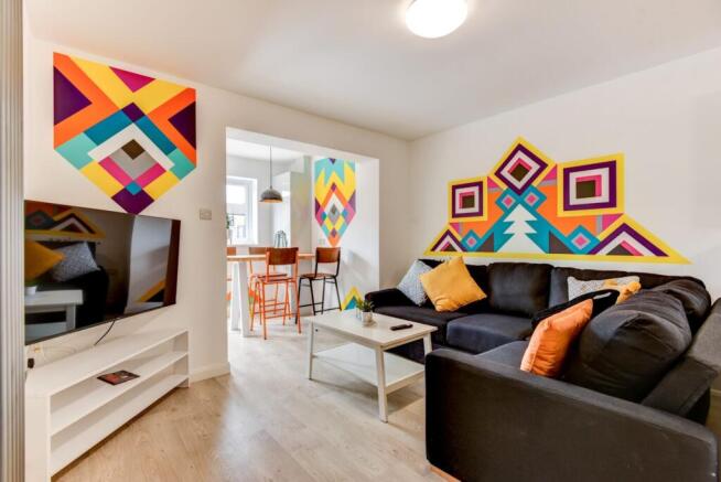 Bright, contemporary living room with a large s...