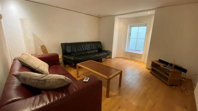 Spacious living area with comfy leather seating...