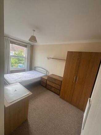 Bright double bedroom with ample storage space...