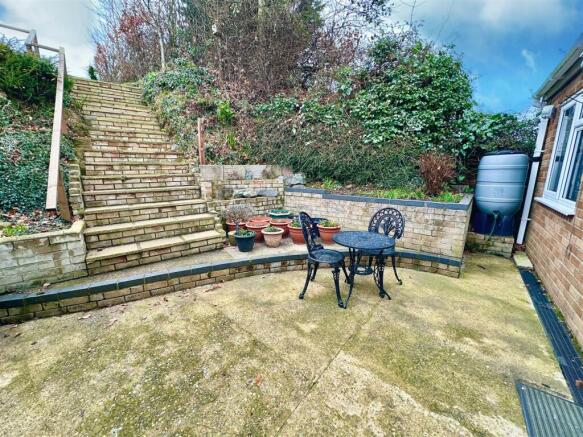 patio with stepd to upper rear garden.jpg