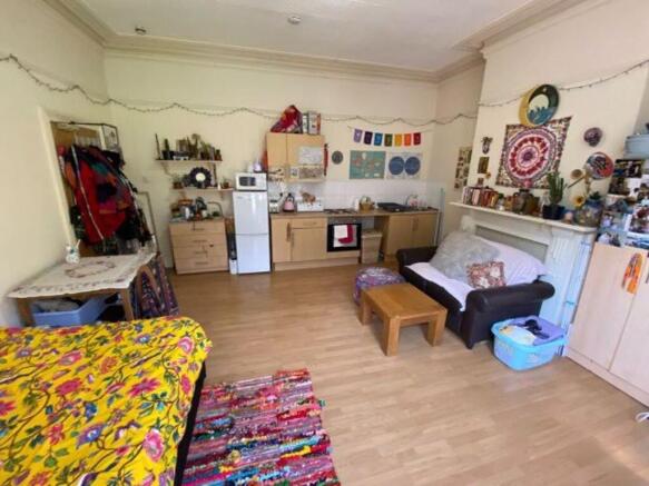 A cozy living room with a colorful and eclectic...