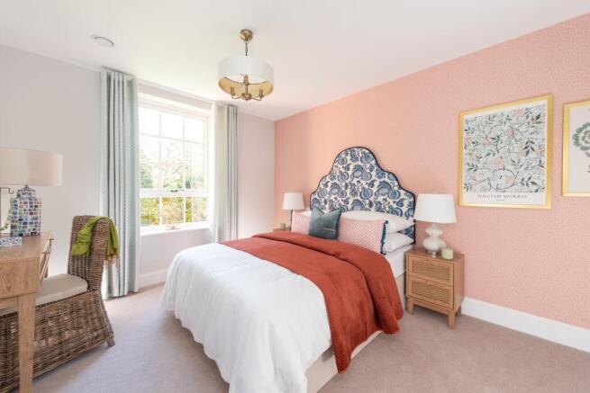 a bedroom with a bed and lamps