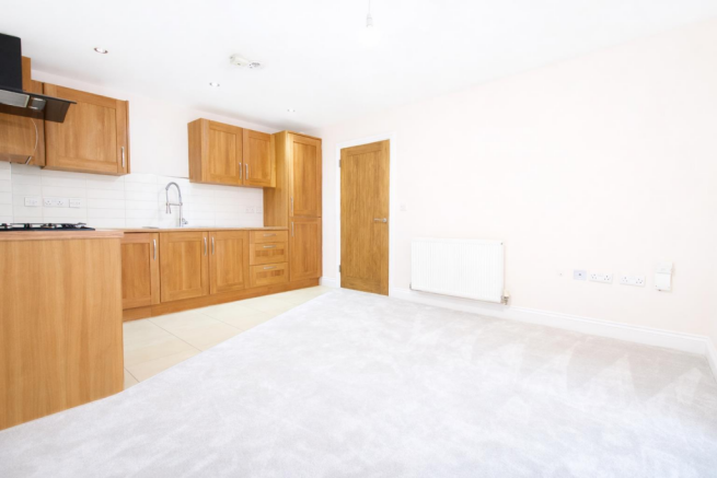 Spacious modern kitchen and living area.png