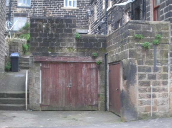 Garage and driving range below the front garden.