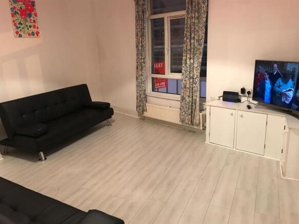 Spacious living room with comfortable sofas...
