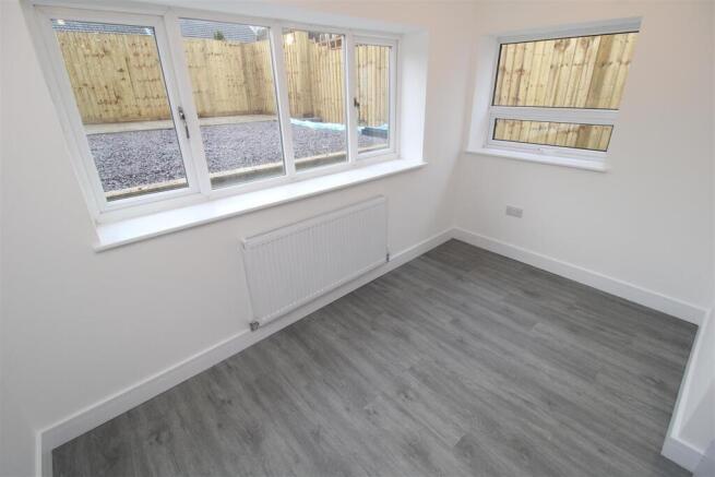 Bright modern room with sleek wood-grey wood ef...