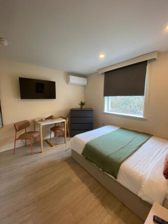 Bright, neatly presented double bedroom with a ...