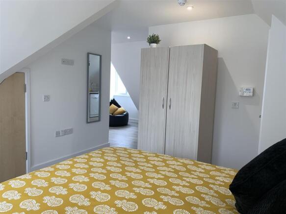 Bright, modern bedroom with ample storage space...