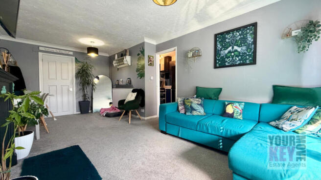 Living room with blue sofa at Tunstall Road in Can