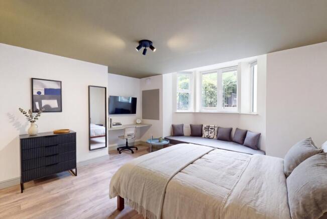 Bright bedroom with window seat and study nook...
