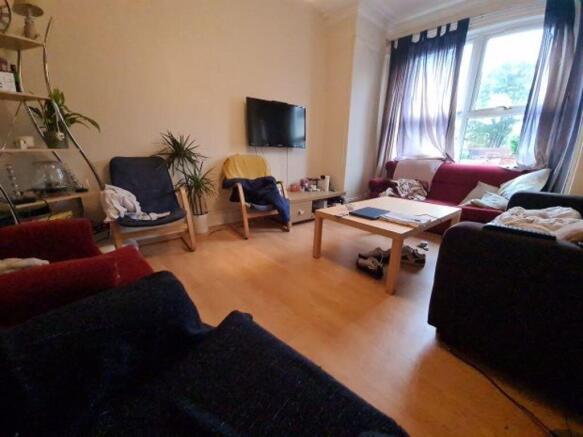 Bright and welcoming living area featuring comf...