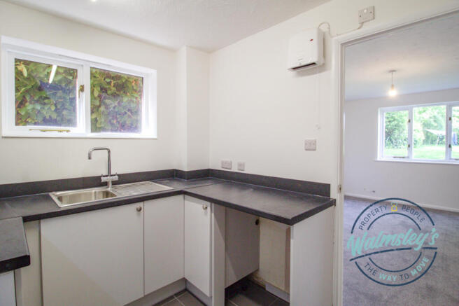 Kitchen with living room beyond