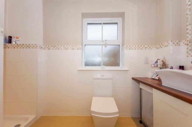 Bright, modern bathroom with a contemporary toi...