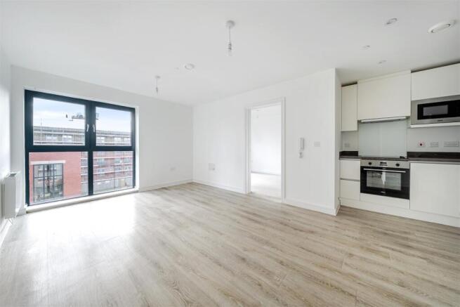 Bright open-plan living with modern kitchen are...