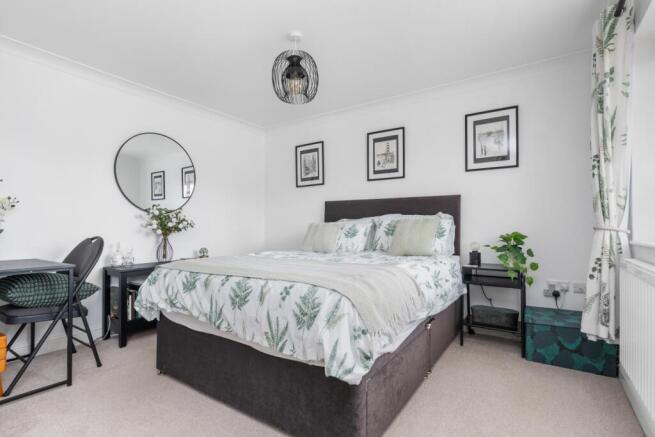 This spacious room easily fits the kingsize bed