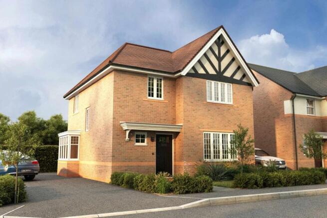A two-story brick house with a distinctive Tudor-style facade