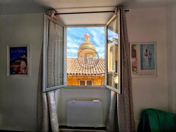 Bright living space with a charming view of a hist