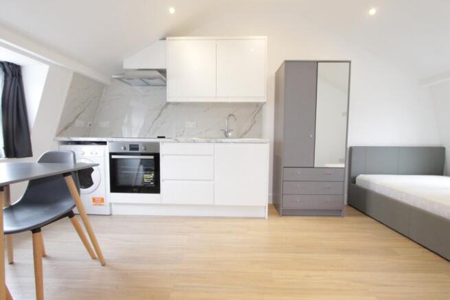 Modern studio with sleek kitchen and double bed...