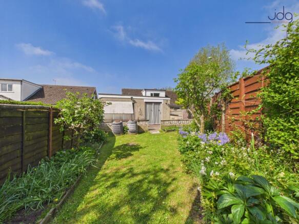 Private, well-established garden with lawn, patio seating and space to grow