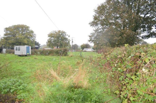 ADJOINING LAND