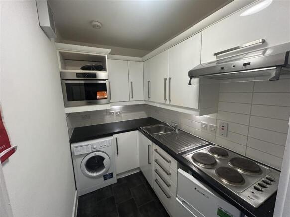 Modern fitted kitchen with integrated appliance...