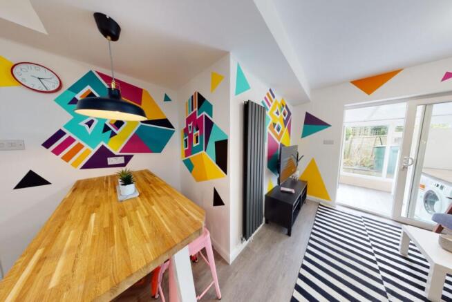 Bright, modern living space with bold geometric...