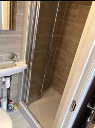 A clean and modern bathroom featuring a spaciou...
