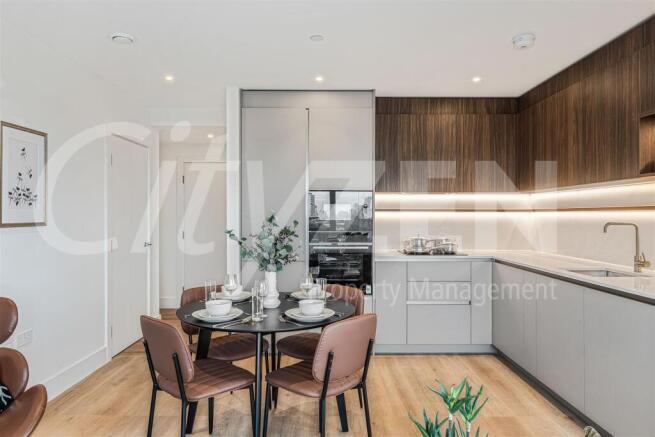 DINING AREA/KITCHEN (PHOTO OF SIMILAR APARTMENT)