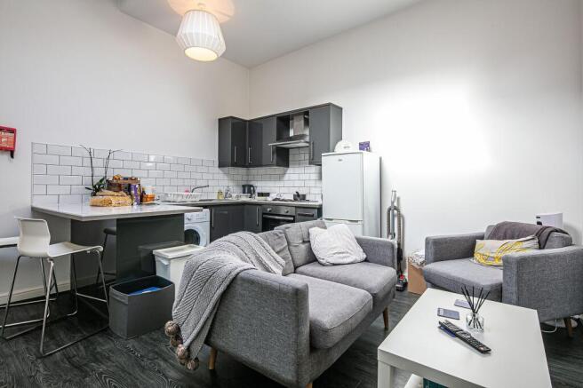 Bright, modern open-plan living area with a com...